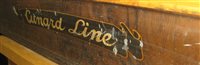 Lot 123 - A TRAVEL AGENT'S PRESSED TIN PRINTED SIGN, THE...