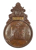 Lot 56 - A FINELY CAST BRONZE BADGE FOR H.M.S. SUSSEX R.N.V.R.
