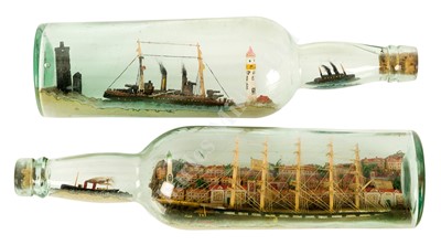 Lot 100 - AN HISTORICALLY INTERESTING PAIR OF SHIPS IN BOTTLES MODELLED BY A GERMAN PRISONER ON THE ISLE OF MAN, 1917
