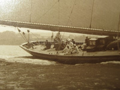 Lot 198 - A SEPIA PHOTOGRAPH OF H.M. RACING YACHT BRITANNIA BY BEKEN OF COWES