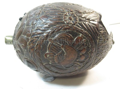 Lot 159 - AN EARLY 19TH CENTURY CARVED COCONUT BUGBEAR POWDER FLASK