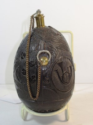 Lot 29 - A FINELY CARVED COCONUT BUGBEAR FLASK, FIRST QUARTER 19TH CENTURY