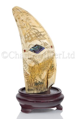 Lot 121 - Ø AN UNUSUAL SCRIMSHAW DECORATED WHALE'S TOOTH