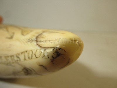 Lot 121 - Ø AN UNUSUAL SCRIMSHAW DECORATED WHALE'S TOOTH