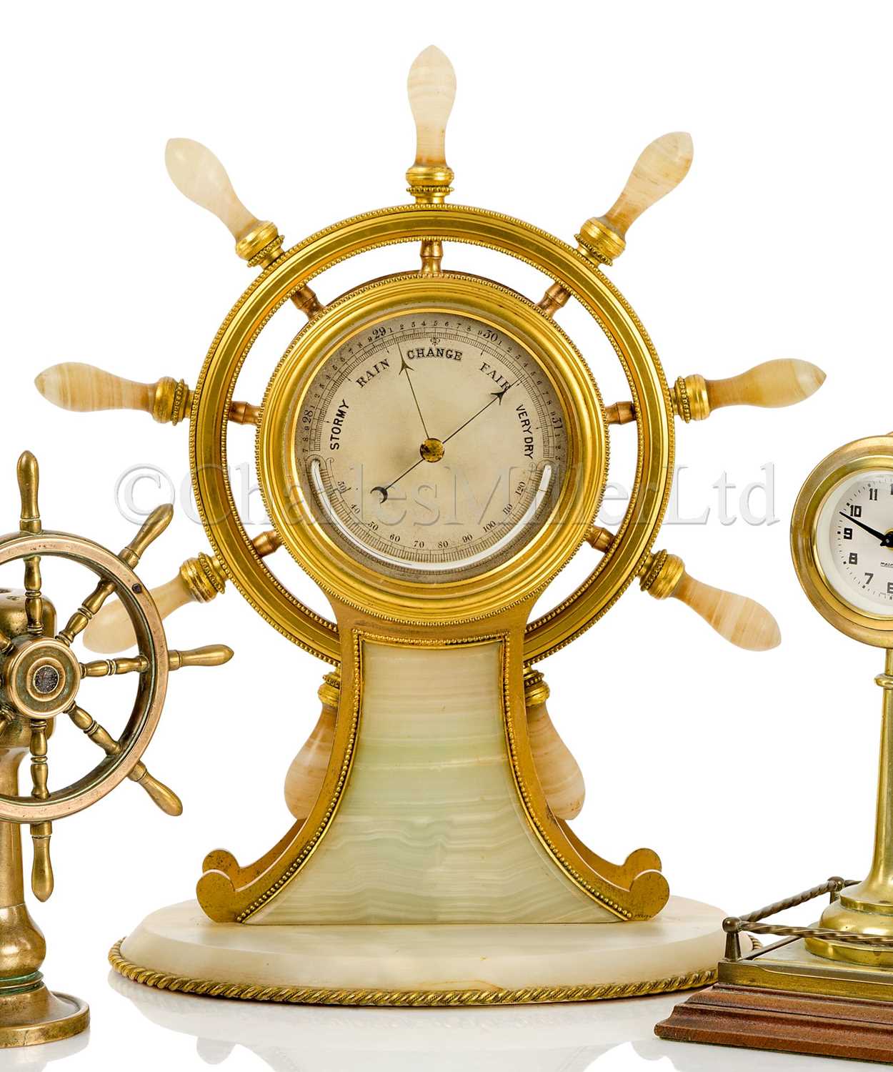 Lot 41 - A FINE AND LARGE GILT, BRASS AND AGATE SHIP’S WHEEL DESK BAROMETER, ATTRIBUTED TO BETJEMANN & SONS CIRCA 1870