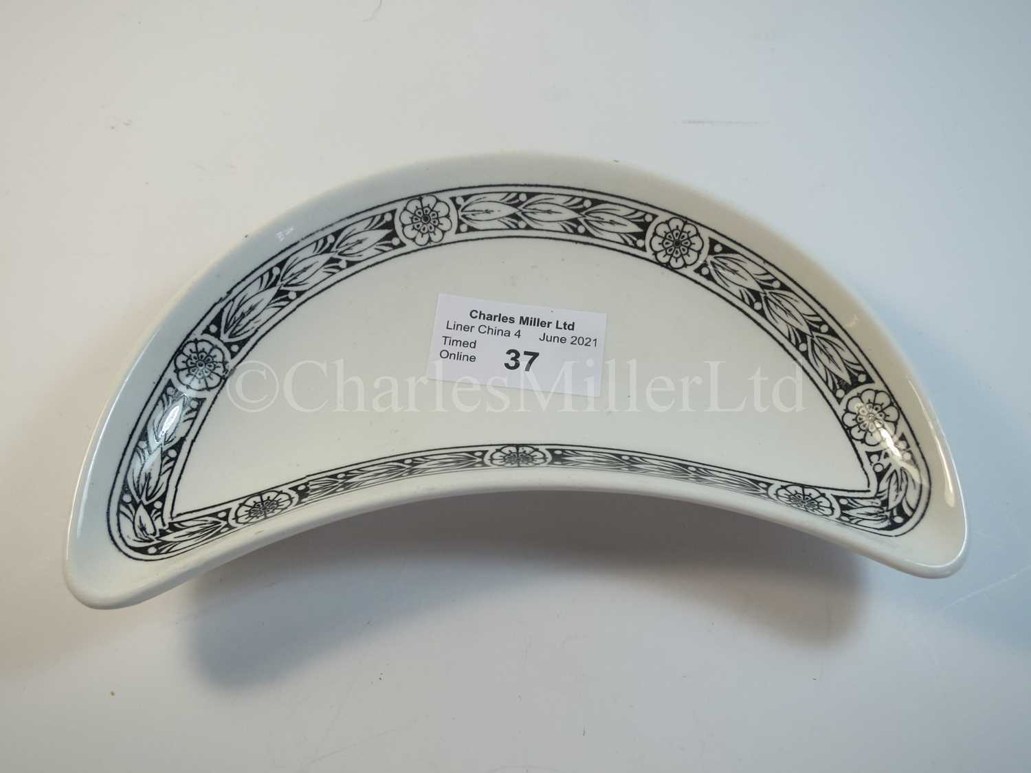 Lot 37 - An Elder Dempster Lines crescent side plate -- 6½in. (16.5cm.) diameter from the widest point
