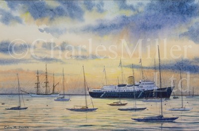 Lot 337 - COLIN M. BAXTER (BRITISH, B. 1963) : Sunset at Cowes H.M.Y. ‘Britannia’; Schooner entering Falmouth past St. Anthony’s Head Lighthouse, circa 1930