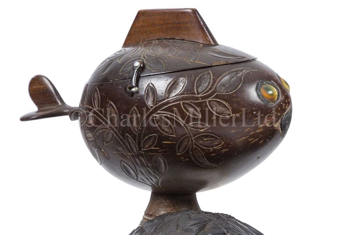 Lot 38 - A CARVED COCONUT BOX IN THE FORM OF A FISH