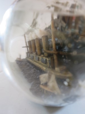 Lot 79 - A COMMEMORATIVE SHIP IN BOTTLE MODEL OF R.M.S. LUSITANIA MADE BY A SURVIVOR, 1915