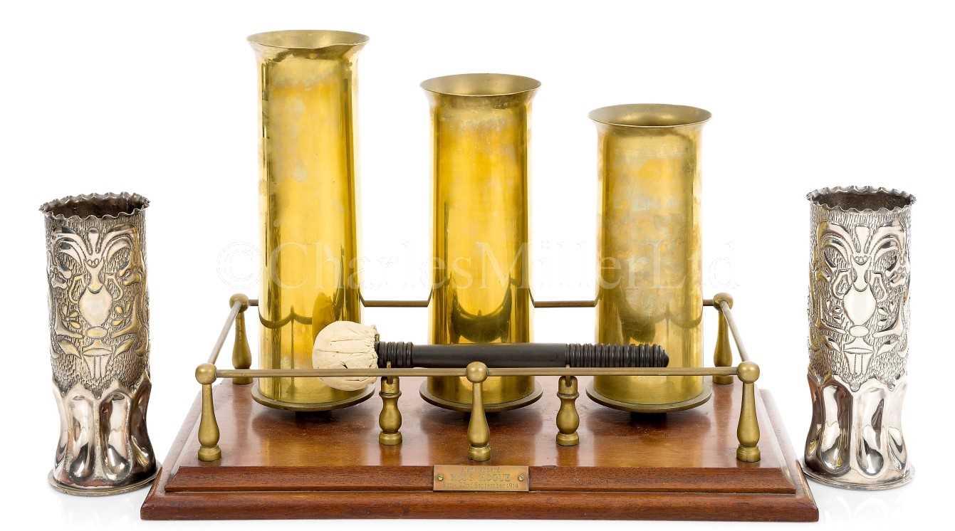 Lot 274 - A TABLE GONG MADE FROM SHELL CASES ON BOARD H.M.S. HOGUE