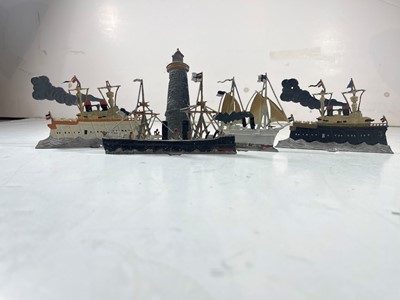 Lot 100 - COLLECTION OF GERMAN LEAD TOY LIGHTHOUSE AND BATTLESHIPS, CIRCA 1890