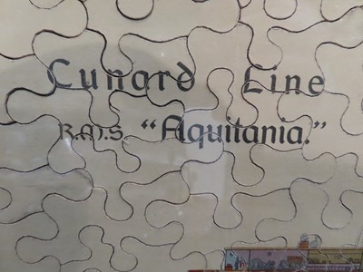 Lot 68 - A FRAMED JIGSAW OF R.M.S. 'AQUITANIA', 1914