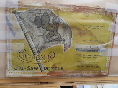 Lot 68 - A FRAMED JIGSAW OF R.M.S. 'AQUITANIA', 1914
