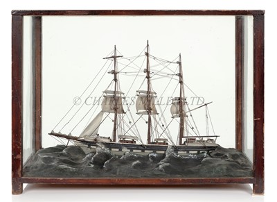 Lot 33 - AN UNUSUAL 19TH CENTURY SAILOR'S MODEL OF THE MERCHANT SHIP BLIND LOVE RUNNING UNDER SHORTENED SAIL IN A STORMY SEA