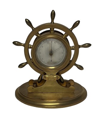 Lot 46 - A BRASS SHIP'S WHEEL DESK BAROMETER, CIRCA 1890