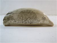 Lot 131 - Ø A 19TH CENTURY SCRIMSHAW DECORATED WHALE'S TOOTH