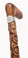 Lot 133 - A WALKING STICK CARVED FROM TIMBER RECOVERED...