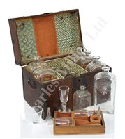 Lot 164 - AN EARLY 19TH CENTURY TRAVELLING DECANTER SET