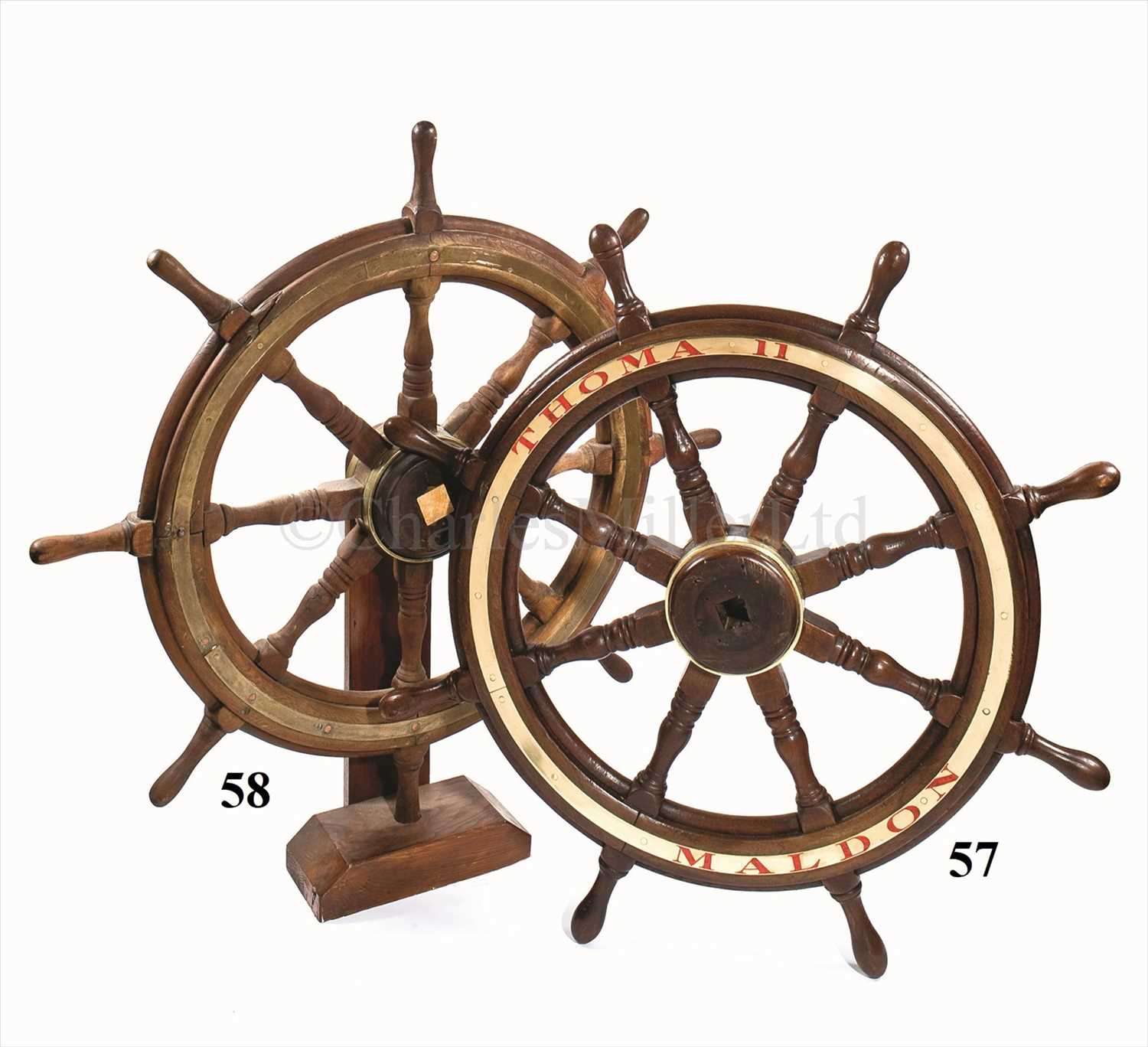 Lot 57 - The eight spoke teak helm from the historic...
