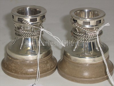 Lot 50 - A PAIR OF SILVER DWARF CANDLESTICKS <br/>modelled...