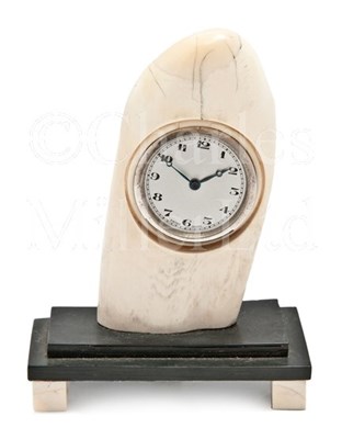 Lot 125 - A WHALE TOOTH DESK CLOCK<br/>comprising an...