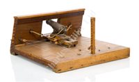 Lot 73 - A 19TH CENTURY SECTION MODEL OF A CARRONADE SETTING ABOARD A SHIP OF THE LINE