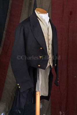 Lot 81 - AN EARLY 19TH-CENTURY NAVY BLUE FROCK COAT AND...