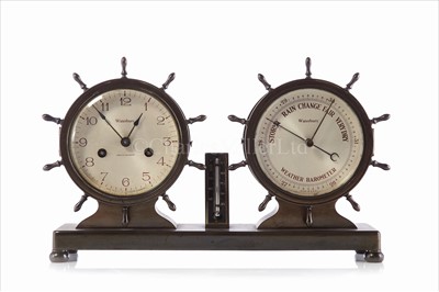 Lot 162 - A TWIN CLOCK AND ANEROID BAROMETER DESK SET BY...