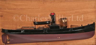 Lot 275 - A HALF-BLOCK MODEL OF A TUG BOAT<br/>the carved...